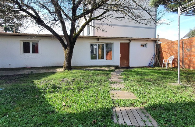 Pleasant outbuilding in front of a garden in a quiet area