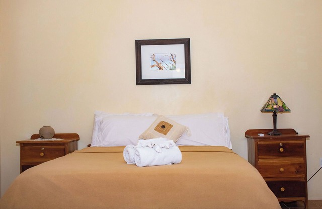 Queen-size bed, with a private bathroom, a walk-in shower and closet.