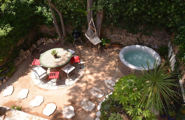 quiet house with shaded garden and jacuzzi