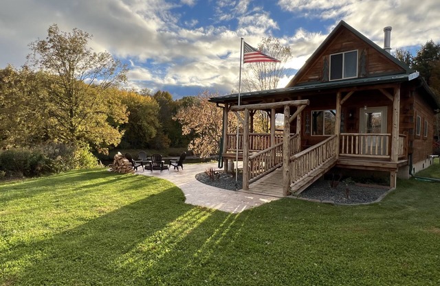 Relax at The Lincoln Log Cabin perched along the Jump River.