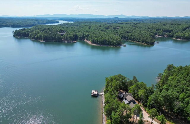 Relax in style w/access to Lake, Dock, Fire pit and Community Pool