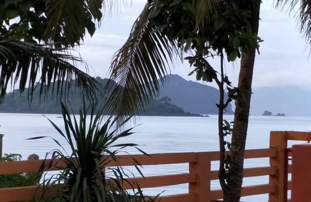 Relaxing beach side condo with mountain and island views.
