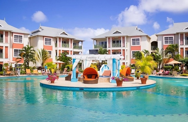 Relaxing Getaway Awaits! Four Units with Garden View, Outdoor Pool, Beachfront!