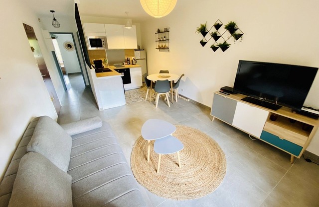 Renovated 2-room apartment with balcony and private parking