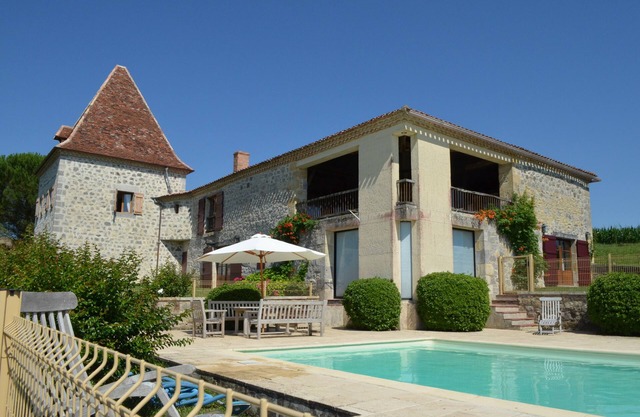 Restored 18th century farmhouse with swimming pool and tennis court. Large view.