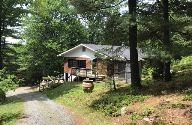 Retreat into the woods and discover peace. And a hot tub with a view