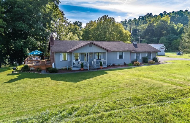 Riverfront home with dock, mountain view, grill, firepit, smart TVs