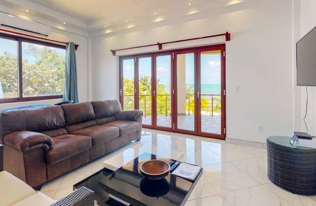 Romantic beachfront apartment w/ ocean views, shared pool, partial AC & WiFi!