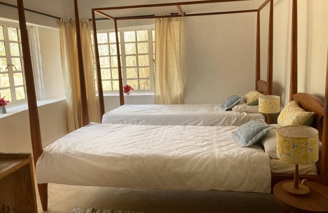Romantic eco cottage within the Arusha Giraffe Centre re-wilded farm.