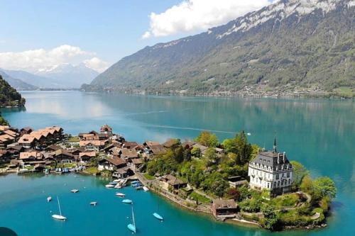 Romantic Swiss Alp Iseltwald with Lake & Mountains
