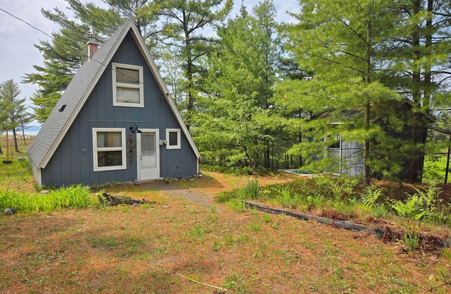 Rustic A-Frame Retreat on Grand Traverse Bay w/beach, wifi, fire pit & grill