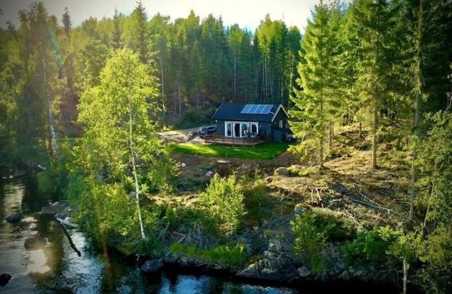 Scandinavian forest view by the water with no neighbors.