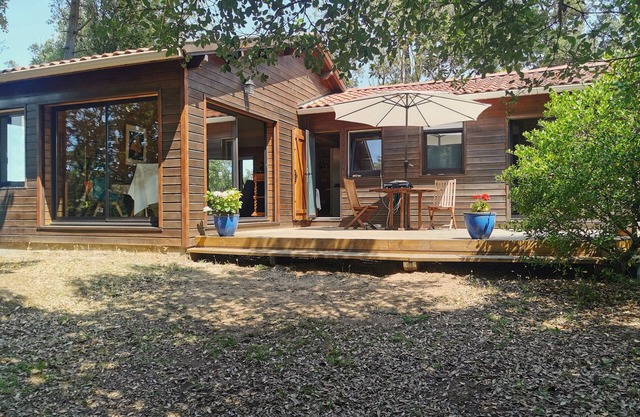 Sea-view house with large terrace and wooded grounds.
