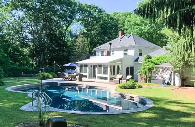 Seacoast home with private pool, sunroom, patio, grill, firepit, & fireplace