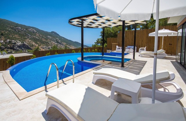 Secluded Two Bedroom Honeymoon Villa with Large Semi-circular Pool and Jacuzzi