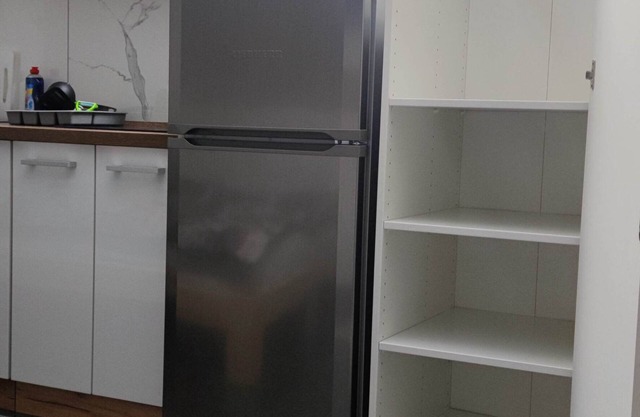 Small room with kitchenette and private bathroom.