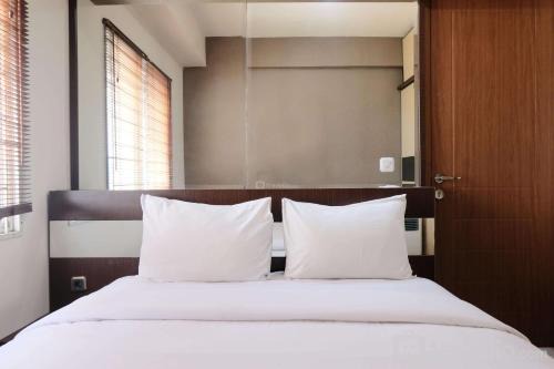 Spacious 3BR Combined Unit at Pinewood Apartment By Travelio