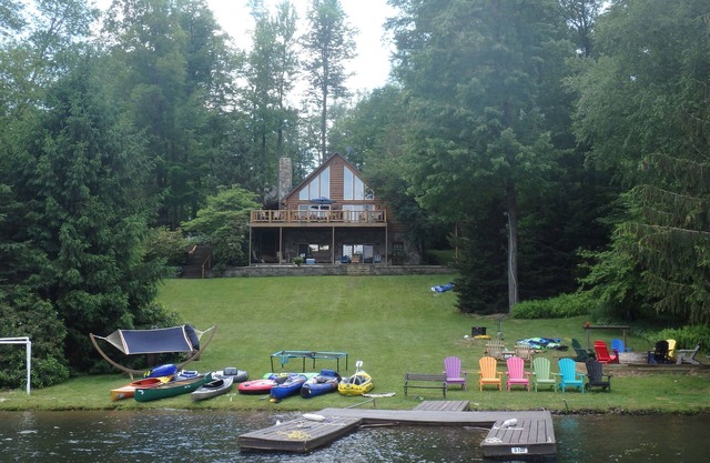 Spacious Lakefront Log Home with large lakefront porch, firepit