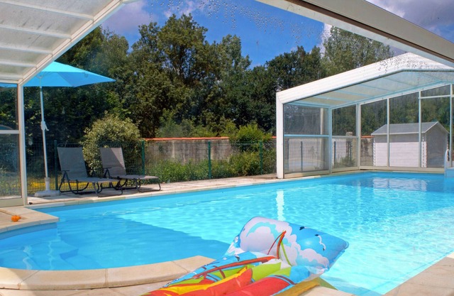 Spacious sunny three bedroomed gite with covered heated pool and river.