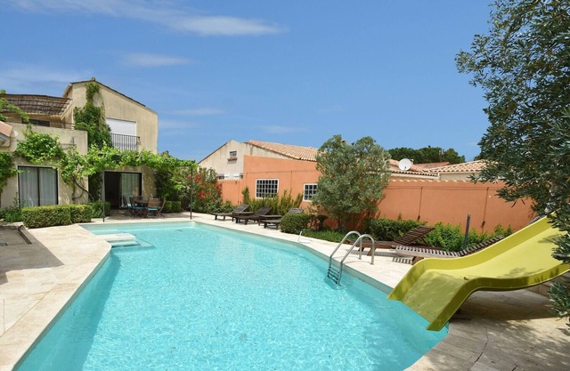 Spacious villa with heated pool with super slide between the beach and lake
