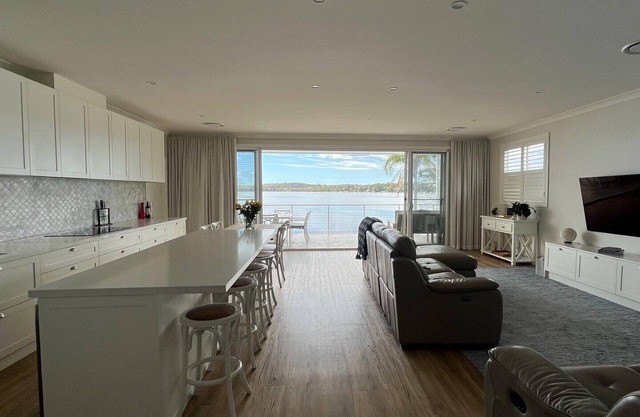 Sparkle by the Lake at this peaceful direct waterfront luxury home