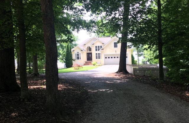 Spectacular Main Lake Sunsets from spacious 4 BR, 3800 sq ft, 1-acre point lot