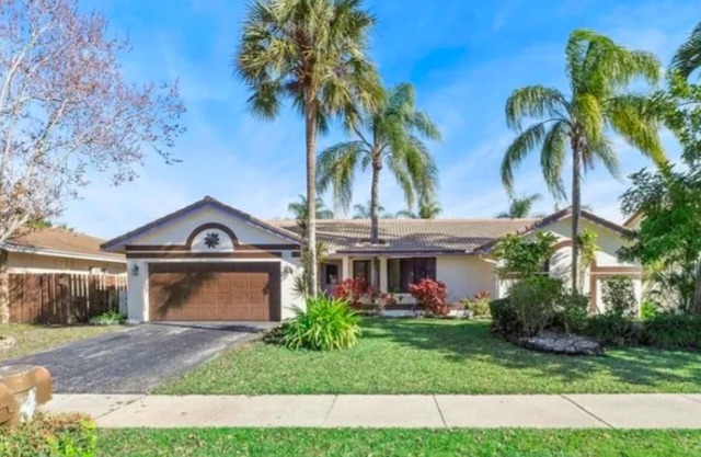 Spectacular stylish 4-bedroom home with pool, large screened patio, lake view.