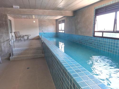 Studio entre Tenório e Praia grande, piscina aquecida