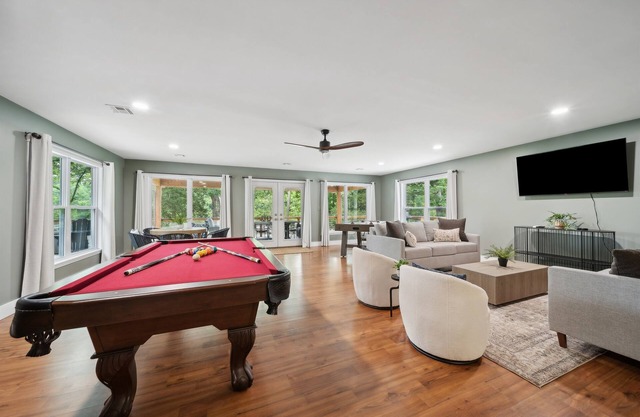 Stunning modern lakefront home, boat slip, pool table, huge deck & more!