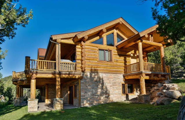 STUNNING views from luxury log home on 44 acres! Two masters! Over 4000 sq feet.