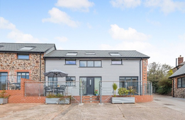 Stylish four-star cottages on a working Devon farm, sleeping up to 14 guests.
