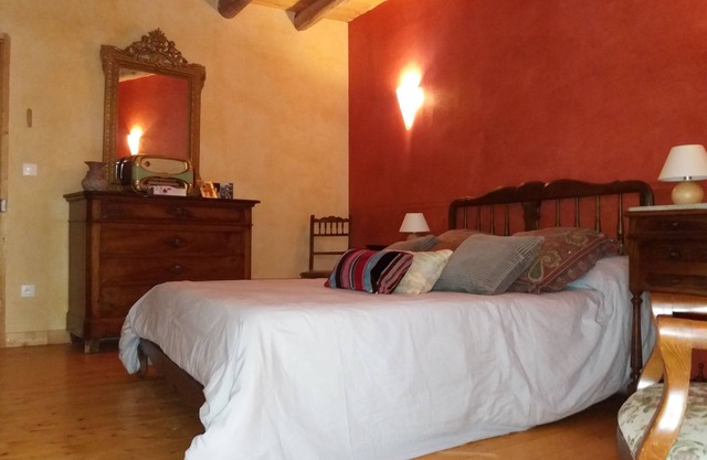 The eighteenth century house is opposite the fortified church of the village.