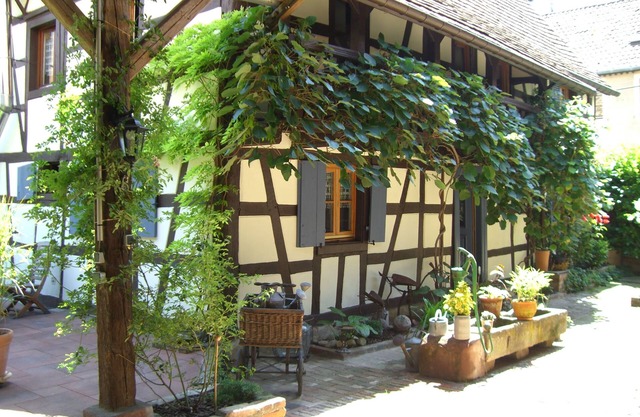 The hospitality of the nice witch in her half-timberings and her calm garden