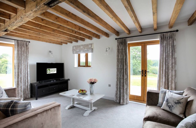 The Stables beautiful new 4 bedroomed barn conversion with use of 3 acre lake.