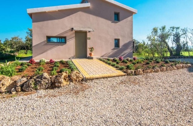 The villa's large private garden leads directly to the outdoor private pool.