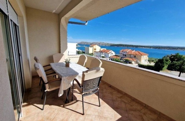 Three bedroom apartment with terrace and sea view Barbat, Rab (A-21809-a)