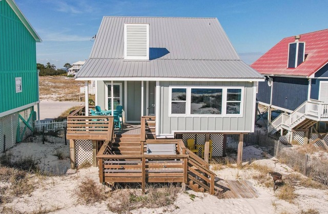 Totally renovated 4 bedroom, 3 bath gulf front home with nice covered deck and large sun room.