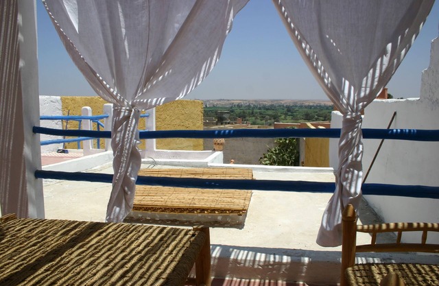 Traditional house with terrace overlooking the palm grove