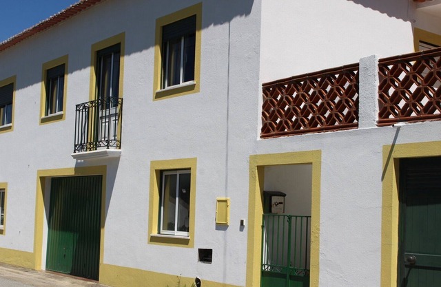 Traditional Portugese house amid wooded hills