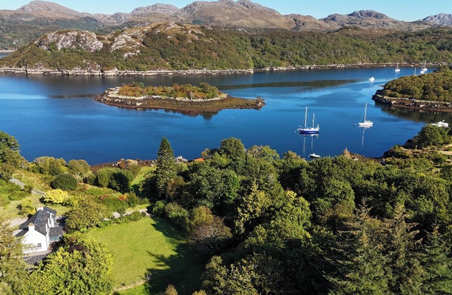 Tranquil modern home, stunning sea and mountain views, private shoreline access.