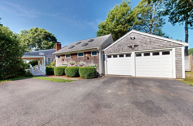 Tree-lined home with lovely yard, decks & private beach access - walk to town