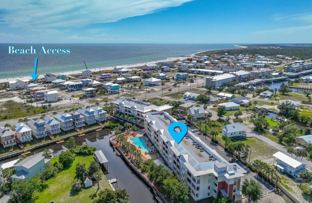Tropical Retreat with Canal Views, Beach Service, Pool, Hot Tub