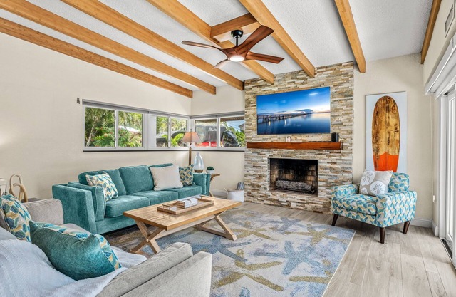 🌴 Tropical Riverfront Retreat w/Heated Pool, Spa, Tiki Hut & Dock!