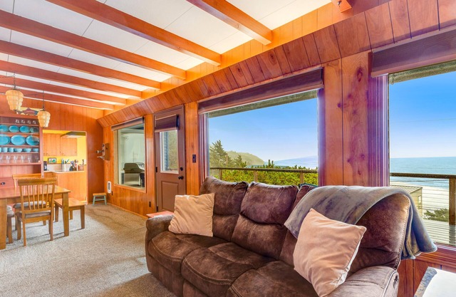 Two-story beach house with an ocean view, furnished deck, & washer/dryer