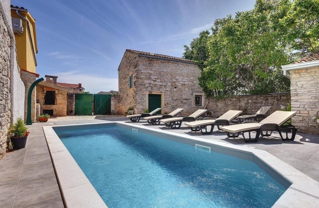 Typical holiday home with private pool, table football, gym