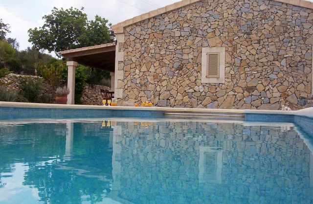 Typical Majorcan house with terrace and pool with beautiful sunset.