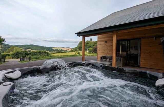 Unique 3 bed cabin with hot tub on Welsh border.