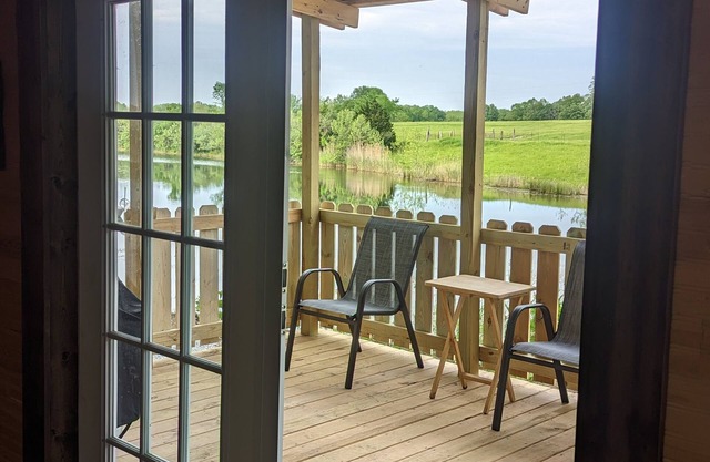 Unique cozy 14x40 Cabin with a nice deck by the water .