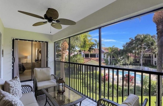 Updated Pelican Bay Condo Near Beach and Overlooking Pool/Tropical Gardens.