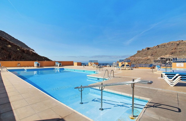 Vacation Apartment 'Paraíso Taurito' with Sea View, Terrace, Shared Pool & Wi-Fi